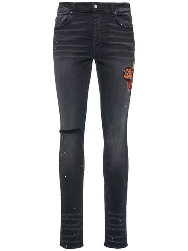 Jean Skinny En Denim Stretch Avec Patchs - AMIRI - Modalova