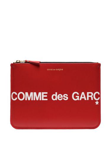 Pochette en cuir à logo imprimé - Comme Des Garçons Wallet - Modalova