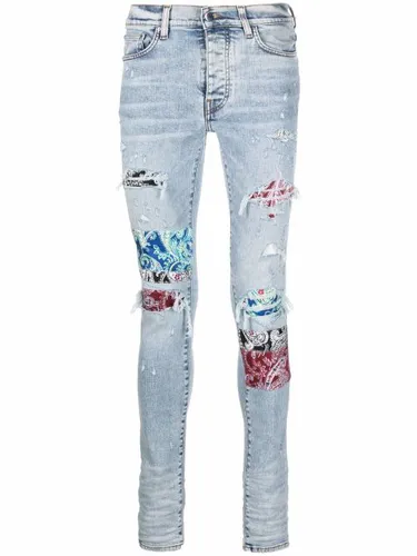 Jean skinny à effet usé - AMIRI - Modalova