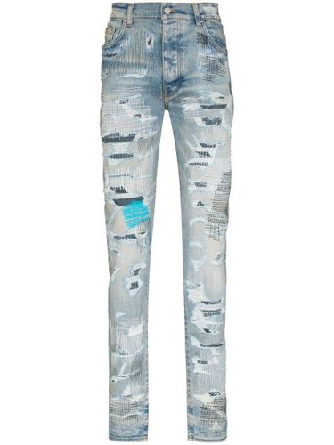 Jean skinny à fini usé - AMIRI - Modalova