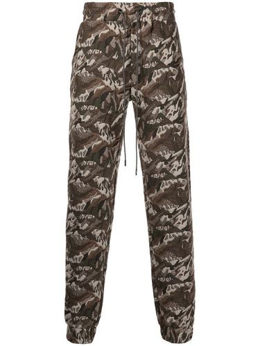 Pantalon de jogging à motif camouflage - Mostly Heard Rarely Seen - Modalova