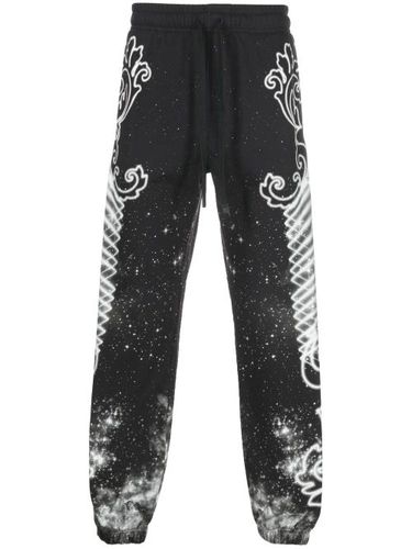 Pantalon de jogging à imprimé graphique - Versace Jeans Couture - Modalova