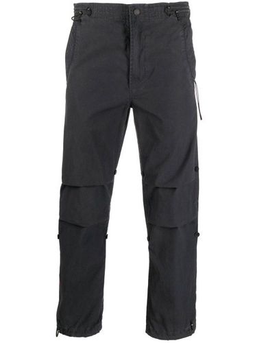 Pantalon slim à fleurs imprimées - Maharishi - Modalova