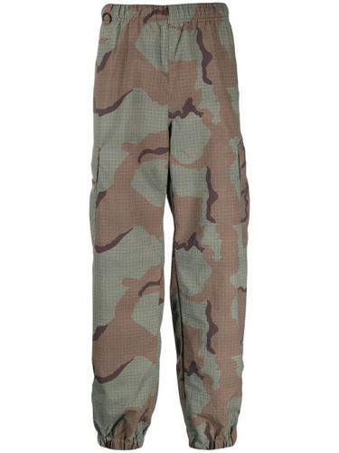 Pantalon de jogging à imprimé camouflage - Undercover - Modalova