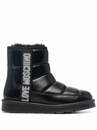 Bottes à logo imprimé - Love Moschino - Modalova