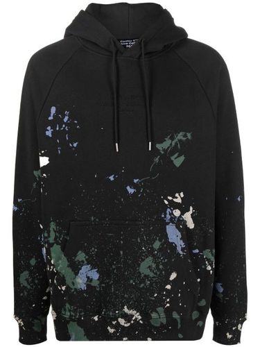 Hoodie en coton biologique à effet taches de peinture - Études Studio - Modalova
