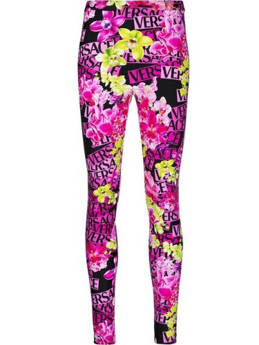 Versace legging à fleurs - Rose - Versace - Modalova