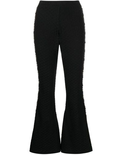 Pantalon évasé à ornements - Izaak Azanei - Modalova