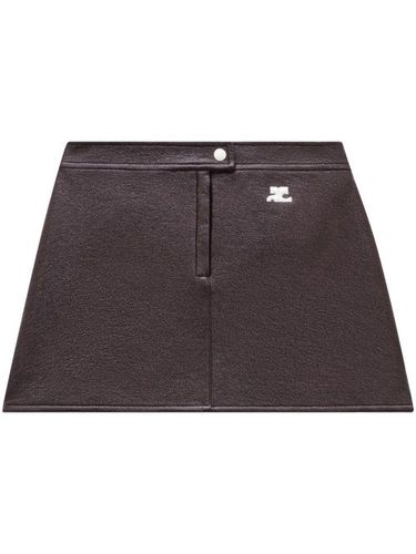 Minijupe en vinyle à patch logo - Courrèges - Modalova
