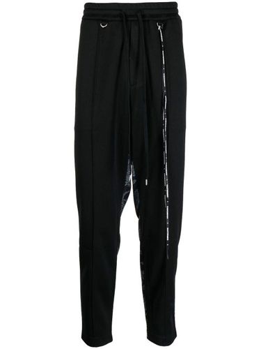 Pantalon de jogging à imprimé camouflage - Mastermind World - Modalova