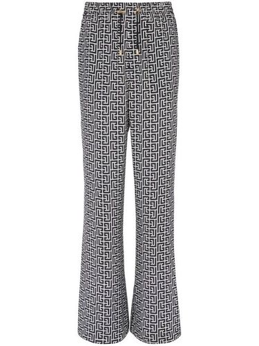 Pantalon ample à motif monogrammé - Balmain - Modalova