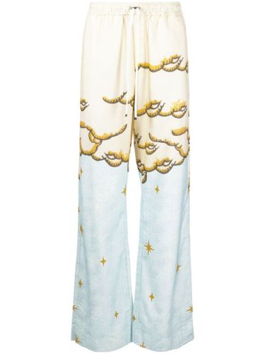 Pantalon évasé à imprimé Sunscape - AMIRI - Modalova