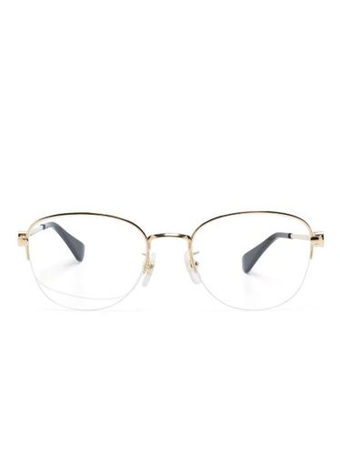 Lunettes de vue rondes à plaque logo - Cartier Eyewear - Modalova