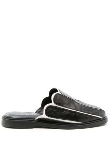 Mules en cuir à bords festonnés - Studio Chofakian - Modalova