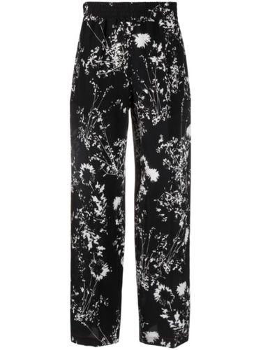 Pantalon en soie à fleurs - Victoria Beckham - Modalova