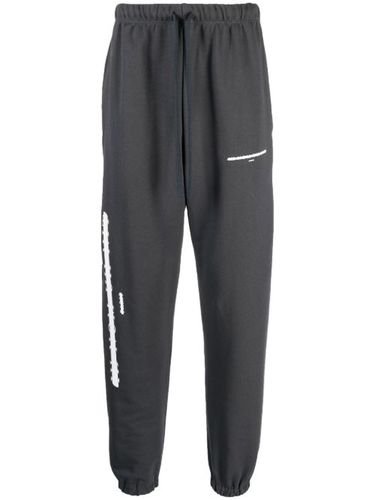 Pantalon de jogging à imprimé graphique - Ih Nom Uh Nit - Modalova