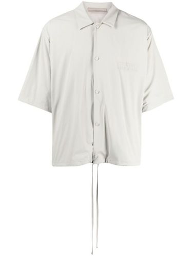 Polo à logo imprimé - FEAR OF GOD ESSENTIALS - Modalova