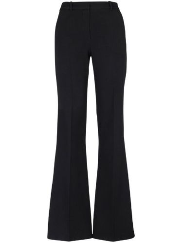 Pantalon en laine à coupe évasée - Balmain - Modalova