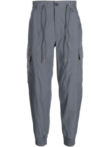 Pantalon fuselé à poches cargo - SONGZIO - Modalova