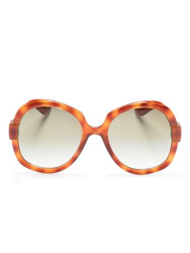 Lunettes de soleil oversize à logo gravé - Gucci Eyewear - Modalova