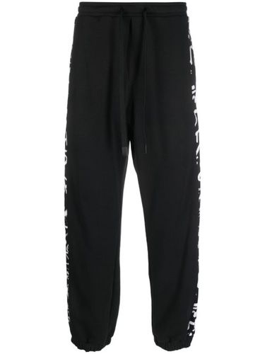 Pantalon de jogging rayé à lien de resserrage - Versace Jeans Couture - Modalova