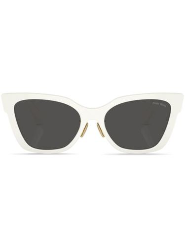 Lunettes de soleil à logo - Miu Miu Eyewear - Modalova