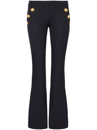 Pantalon en laine vierge à coupe évasée - Balmain - Modalova