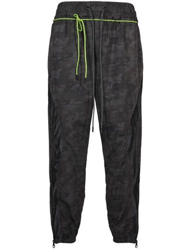 Pantalon de jogging à imprimé camouflage - Mostly Heard Rarely Seen - Modalova