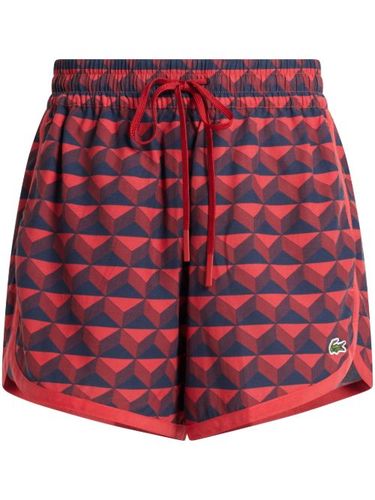 Short de sport à imprimé graphique - Lacoste - Modalova