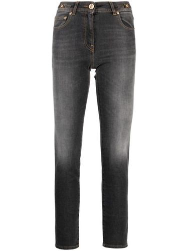Jean skinny à effet délavé - Versace - Modalova