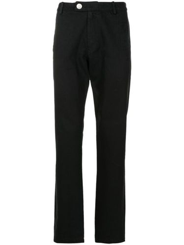Pantalon fuselé en coton à patch logo - Uma | Raquel Davidowicz - Modalova