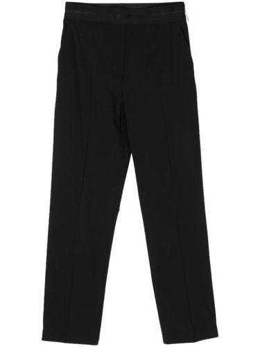 Pantalon en laine vierge à coupe fuselée - MSGM - Modalova