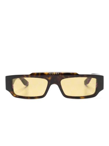 Lunettes de soleil à effet écailles de tortue - Gucci Eyewear - Modalova