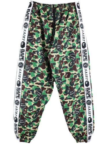 Pantalon de jogging à imprimé camouflage - SAINT MXXXXXX - Modalova