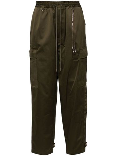 Pantalon fuselé à poches cargo - Mastermind World - Modalova