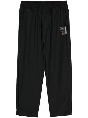 Pantalon droit à logo appliqué - Undercover - Modalova