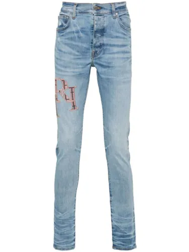 Jean skinny à logo brodé - AMIRI - Modalova