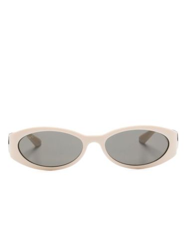 Lunettes de soleil à monture ovale - Gucci Eyewear - Modalova