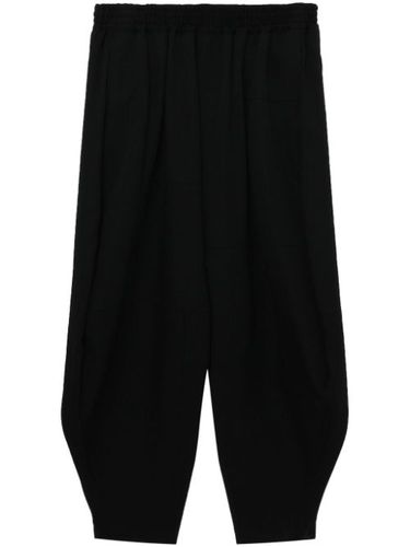 Pantalon en laine à coupe sarouel - Black Comme Des Garçons - Modalova