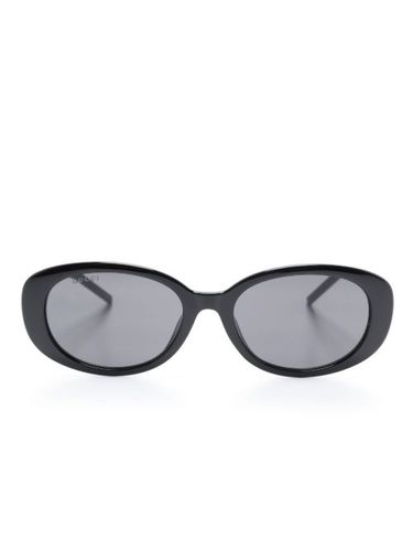 Lunettes de soleil à monture ovale - Gucci Eyewear - Modalova