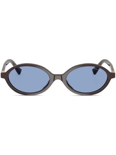 Lunettes de soleil ovales à plaque logo - Miu Miu Eyewear - Modalova