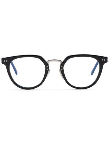 Lunettes à monture ronde - Prada Eyewear - Modalova