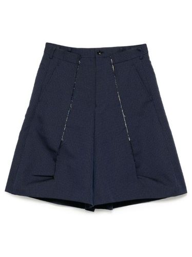 Short à effet usé - Comme des Garçons Homme Plus - Modalova