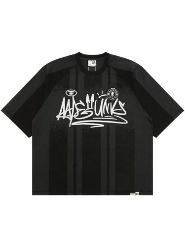 T-shirt rayé à imprimé graffiti - AAPE BY *A BATHING APE® - Modalova