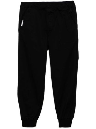 Pantalon fuselé à patch logo - AAPE BY *A BATHING APE® - Modalova