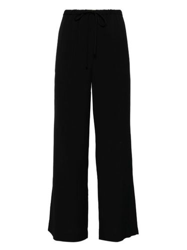 Pantalon rayé à lien de resserrage - TOTEME - Modalova