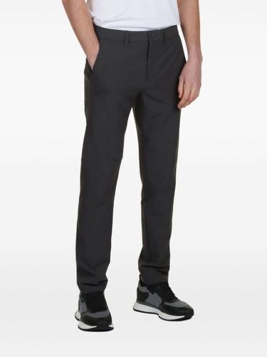 Pantalon chino à patch logo - BOSS - Modalova