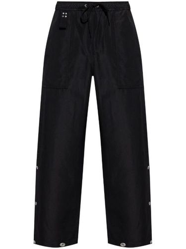 Pantalon à boutons décoratifs - Comme des Garçons Homme - Modalova