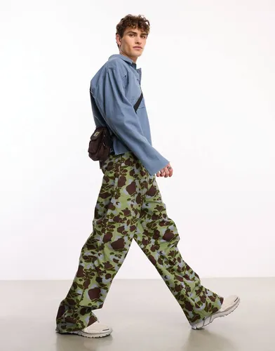 Pantalon baggy à motif camouflage délavé - Collusion - Modalova