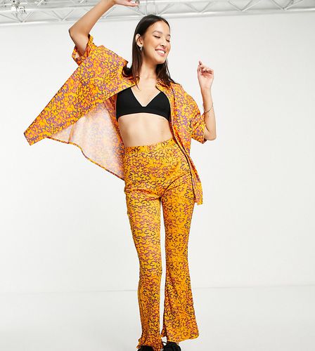 Pantalon d'ensemble évasé et plissé à imprimé floral abstrait - Pêche - Collusion - Modalova